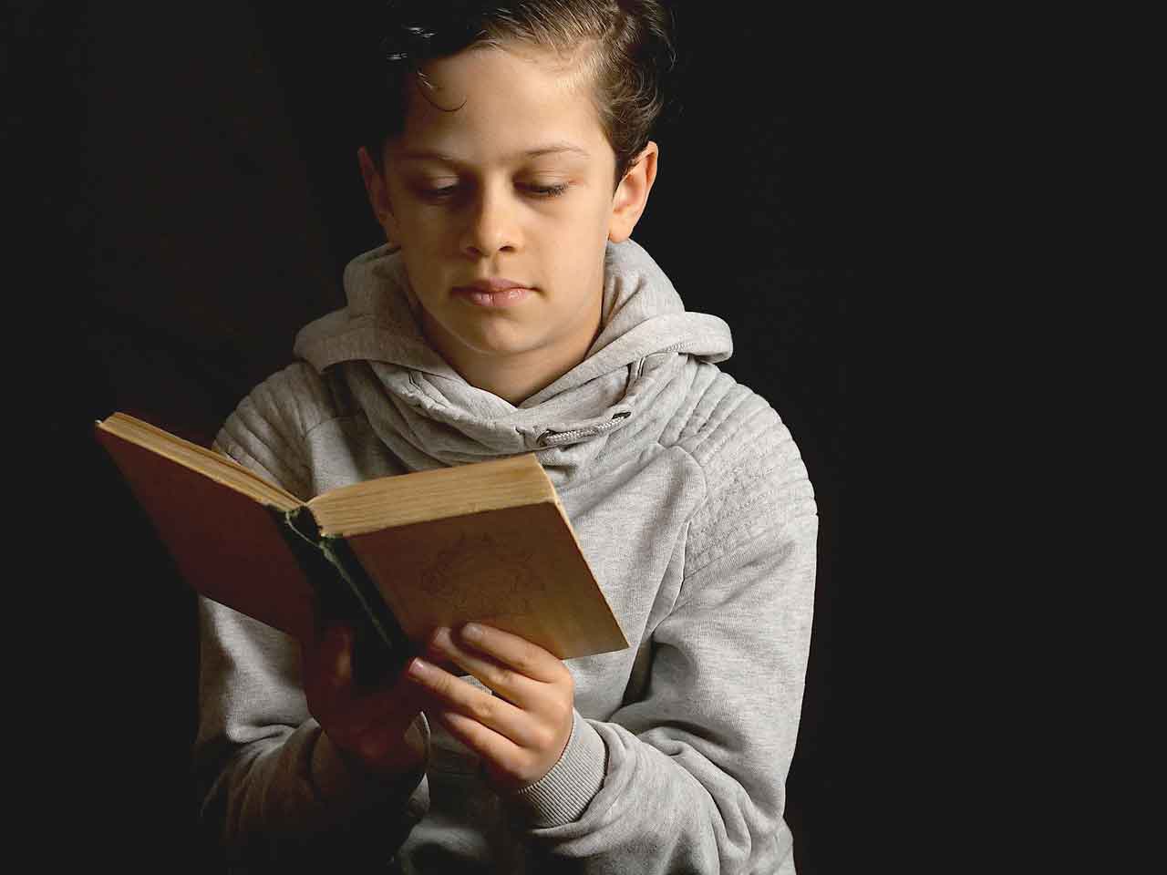 boy-reading-at-home-for-homeschool